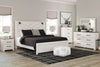Cama con paneles Gerridan King, cómoda, espejo, arcón y 2 mesitas de noche