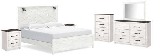 Cama con paneles Gerridan King, cómoda, espejo, arcón y 2 mesitas de noche
