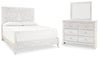 Cama Paxberry King con panel, cómoda y espejo